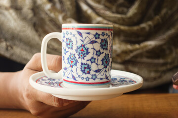 woman drinking turkish coffee at cafe 