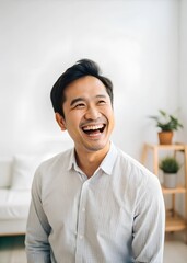 smiling asian man laughing excitement