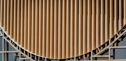 A structure featuring wooden slats on construction site contributing to its architectural style