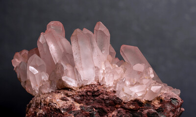 Beautiful pink quartz mineral crystals shine with elegance, showcasing their unique formations and...