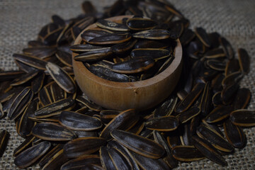 Sunflower seeds in wooden bowl