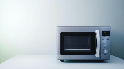 Fototapeta premium Stainless steel microwave oven with digital display on a white background ideal for quick and efficient meal preparation with modern design and multi-functionality. Generative AI