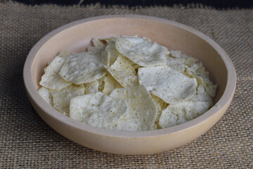 Potato chips in a wooden bowl