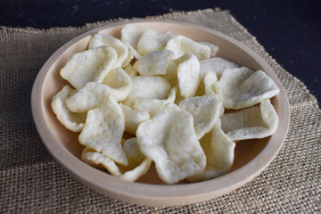 Snack crackers in a wooden bowl