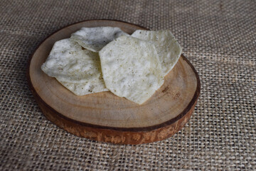 Potato chips on wood chips