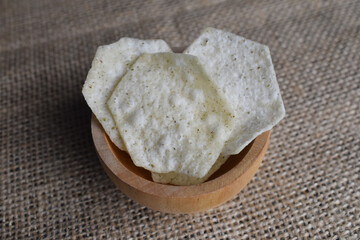 Potato chips in a wooden bowl