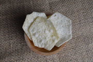 Potato chips in a wooden bowl