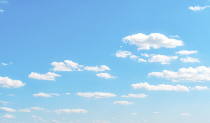 Blue sky with white fluffy cloud. Cumulus clouds background. Cloudscape morning sky. The concepts of freedom of life, never give up and positive though energy.	