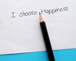 Pencil wrote on paper I CHOOSE HAPPINESS - Positive affirmation to boost self-love and self-compassion - Happiness is a choice and one can choose to be happy
