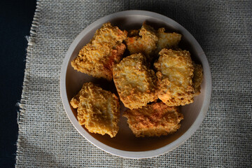 crispy tofu in a wooden bowl