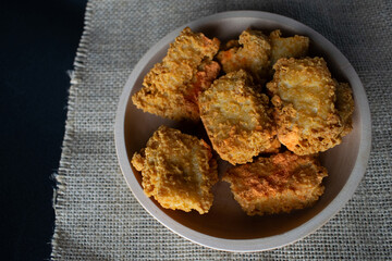 crispy tofu in a wooden bowl