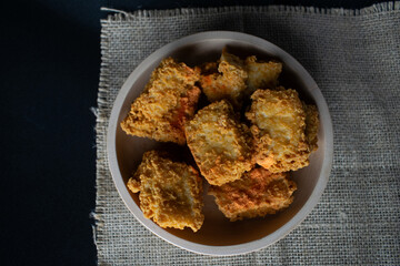 crispy tofu in a wooden bowl