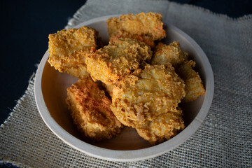 crispy tofu in a wooden bowl