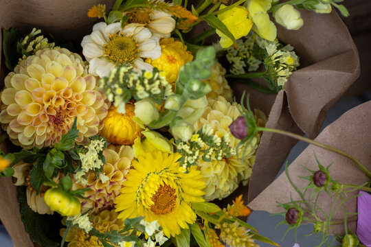 Colorful flower bouquets for sale at a farmers market stand
