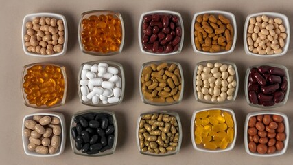 Nutritional supplements and vitamins on the table, top view