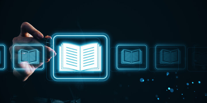 Hand selecting a glowing digital book icon on a futuristic virtual interface.