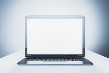 Laptop with blank screen on white table, front view. 3D Rendering
