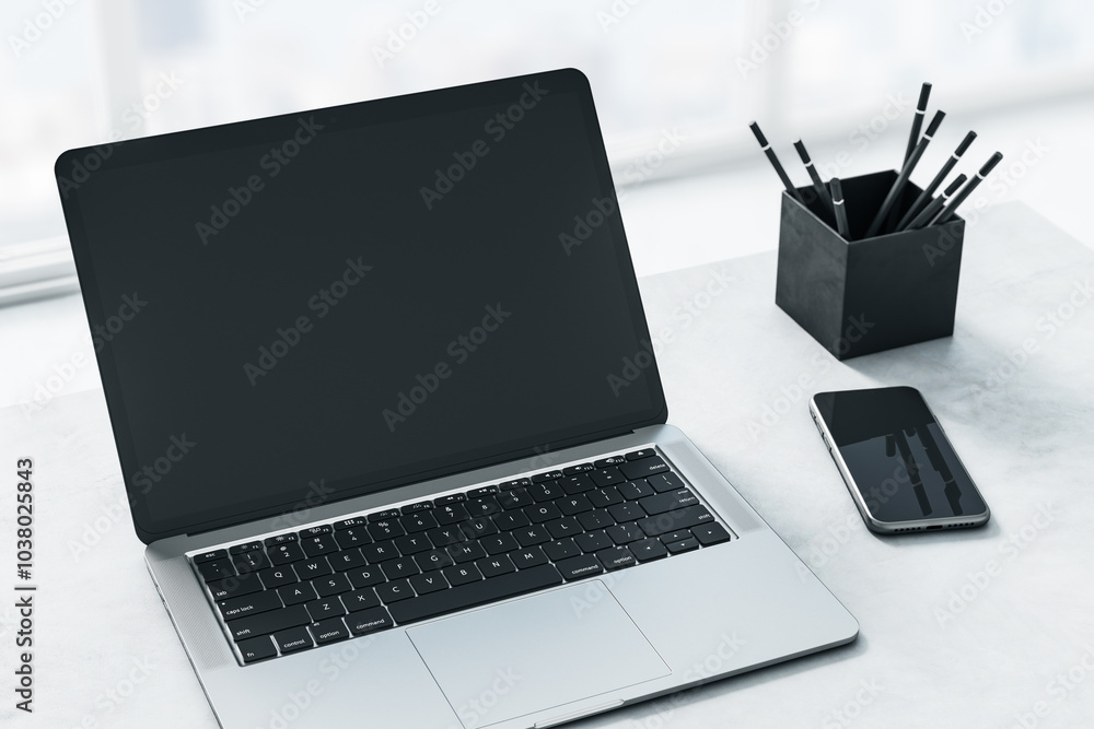 Poster Monochrome concept with perspective view on modern laptop blank black screen with copyspace for your logo or text on light marble surface with pencils and smartphone. 3D rendering, mockup