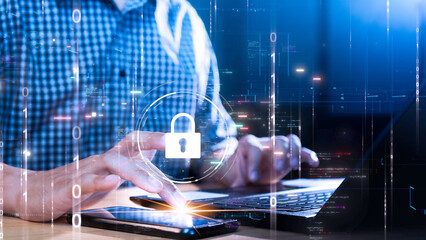 Person using laptop and smartphone with digital key icon symbolizing data security. Binary code and...
