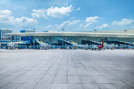 Square ground and terminal building background in airport