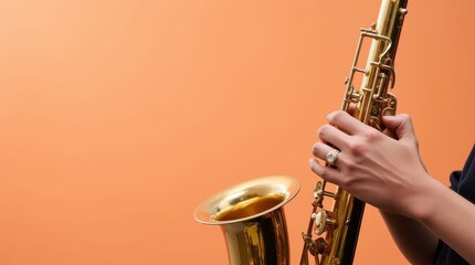 A musician playing a gold saxophone during a jazz performance, isolated with focus on the brass...