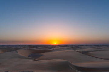 sunset sunrise with beautiful shadow cast on the desert sand dune