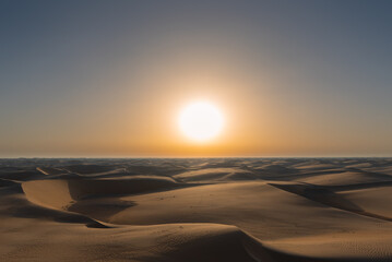 sunset sunrise with beautiful shadow cast on the desert sand dune