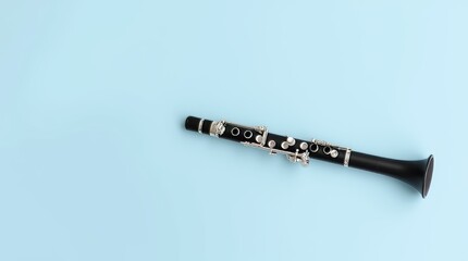 Clarinet isolated on white and black backgrounds, highlighting its silver keys and woodwind details