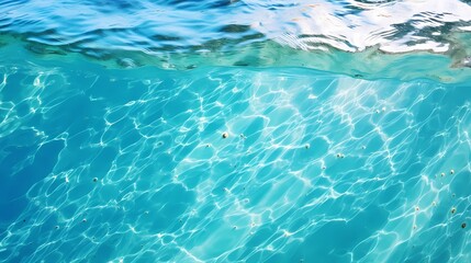 Obraz premium Crystal clear blue water reflecting sunlight beautifully.