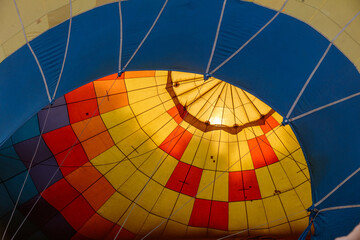 Fototapeta premium A hot air balloon with a yellow and red pattern on it