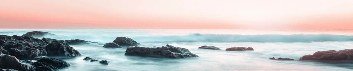 Fototapeta premium Serene Sunrise Over Ocean Waves and Rocky Shoreline