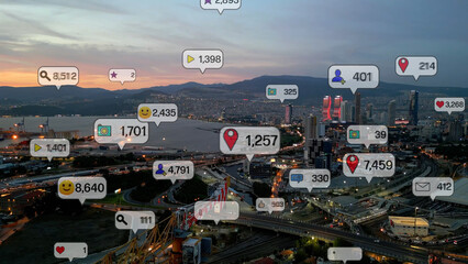 Social media icons fly over city downtown showing people engagement connection through social network application platform . Concept for online community and social media marketing strategy . High