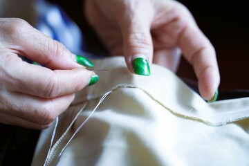 Close-up photo Traditional hand sewing with needles