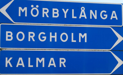 Sign post with directional road signs to the Swedish towns Morbylanga, Borgholm and Kalmar.