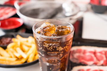 Refreshing Carbonated Beverage with Ice Cubes