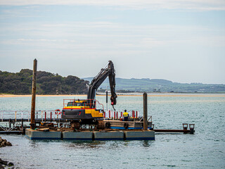 Excavater On Pontoon Boom Swung Right