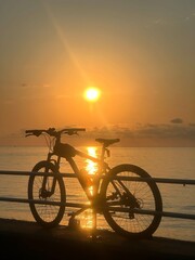Naklejka premium Set bicycles and sunrise