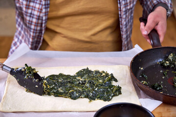 spinach stuffing on top of the dough