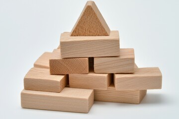 A pyramid structure made of wooden blocks, showcasing basic geometric shapes for educational play and creativity.
