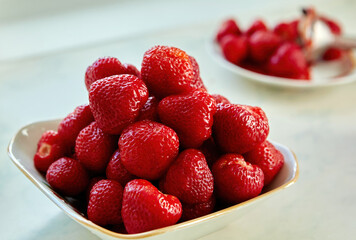 A vibrant pile of luscious strawberries captures the essence of summer.