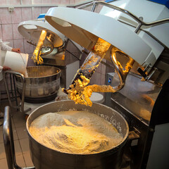 Biscuit production line in a factory showcasing dough mixing and preparation with industrial...