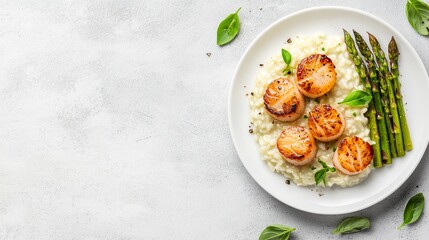 Elegant Dinner Concept with Seared Scallops, Creamy Risotto, and Asparagus on a White Plate