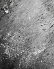 Naklejka premium Textured Metal Surface: A Monochromatic Study of Scratches, Dents, and Wear. A gritty, industrial aesthetic.