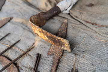 various old farm tools in the blacksmith's forge