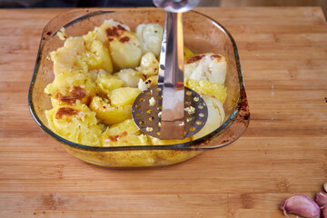 cooks baked potatoes for mashed potatoes