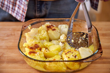 cooks baked potatoes for mashed potatoes