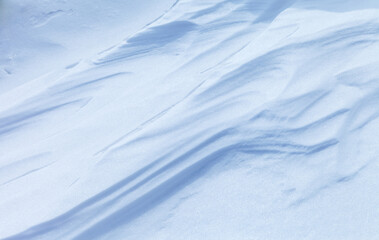 Natural winter texture of snow white crust on frozen Baikal Lake in cold day. Abstract white and blue snowy textured background in form of frozen waves. Blank, copy space, mock up, flat lay, top view