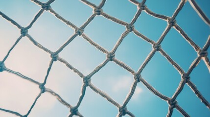 Fototapeta premium A soccer goal net's tangled texture, outdoor setting with clear sky, Dynamic style
