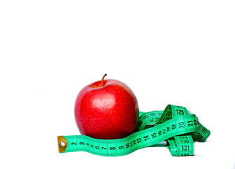dieting with fruits apple losing weight with tape measure on white background no people stock image stock photo 