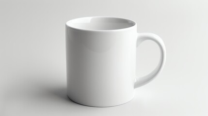 Obraz premium A plain white coffee mug on a white background.
